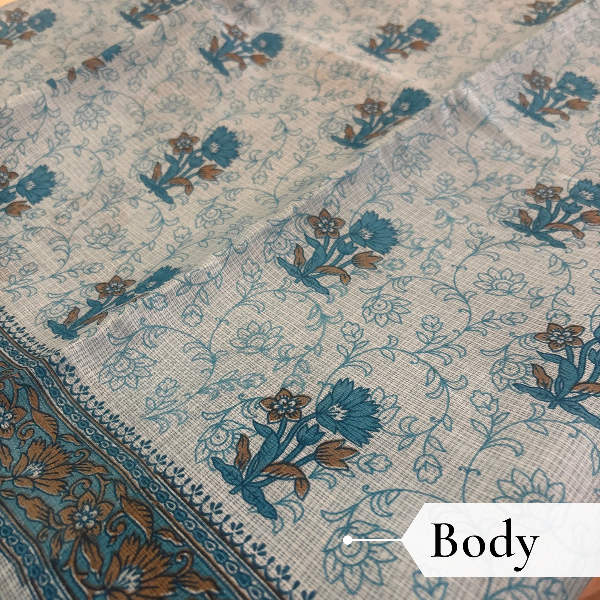Kota Doria Floral Print Saree — Sky Blue — Rozana — draped, walking
