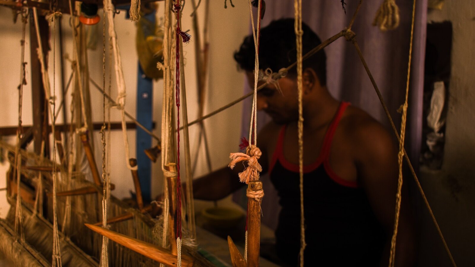 A weaver working at a handloom in Chanderi village