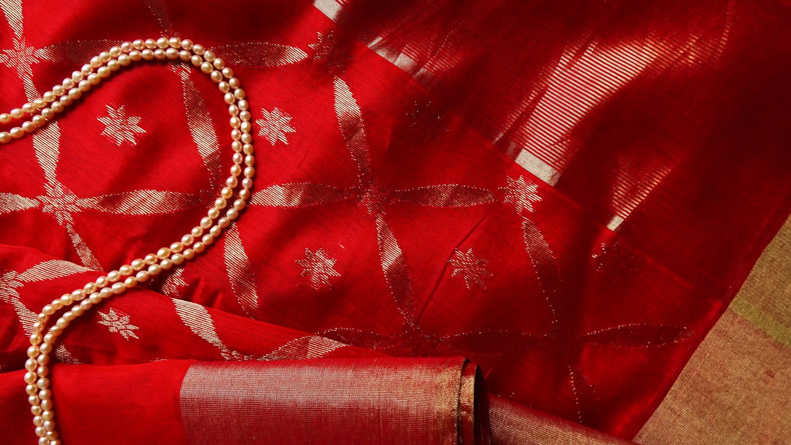 Red saree fabric with gold zari work