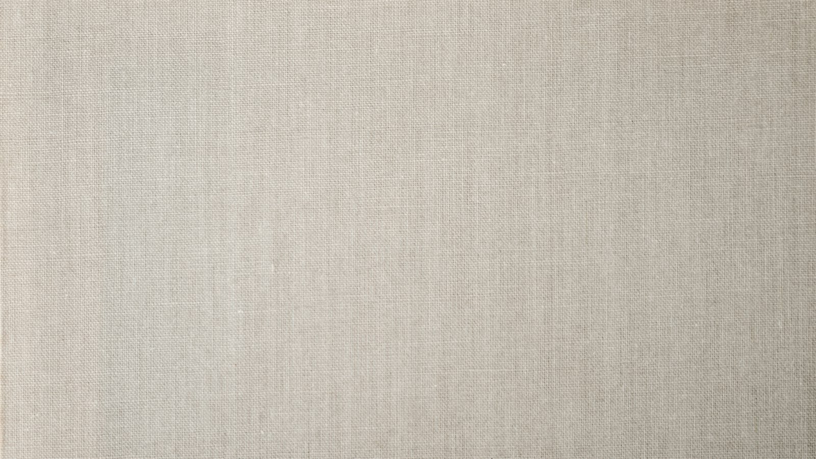 Close-up of beige textured woven fabric