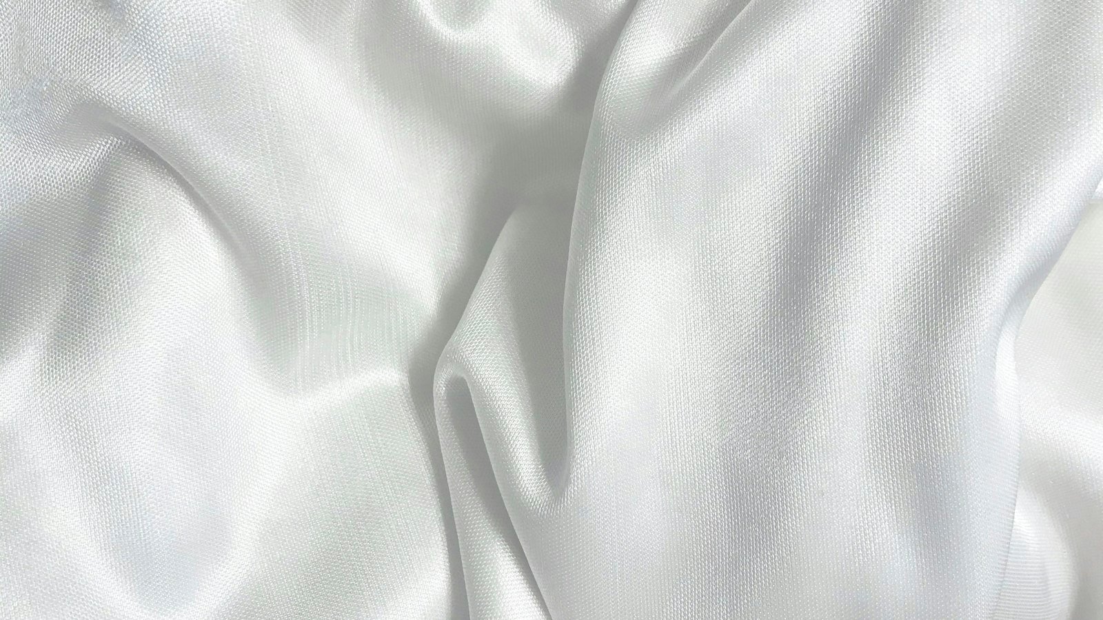 Smooth white fabric draped in soft folds