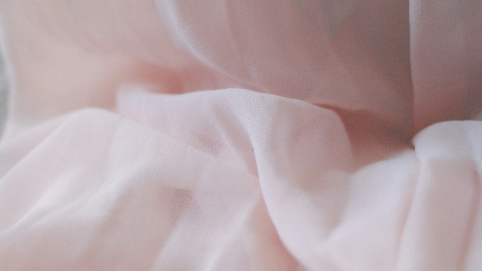 Light pink sheer fabric in soft folds